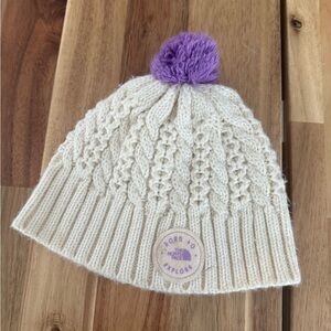 The North Face Cream Knit Beanie with Purple Pom